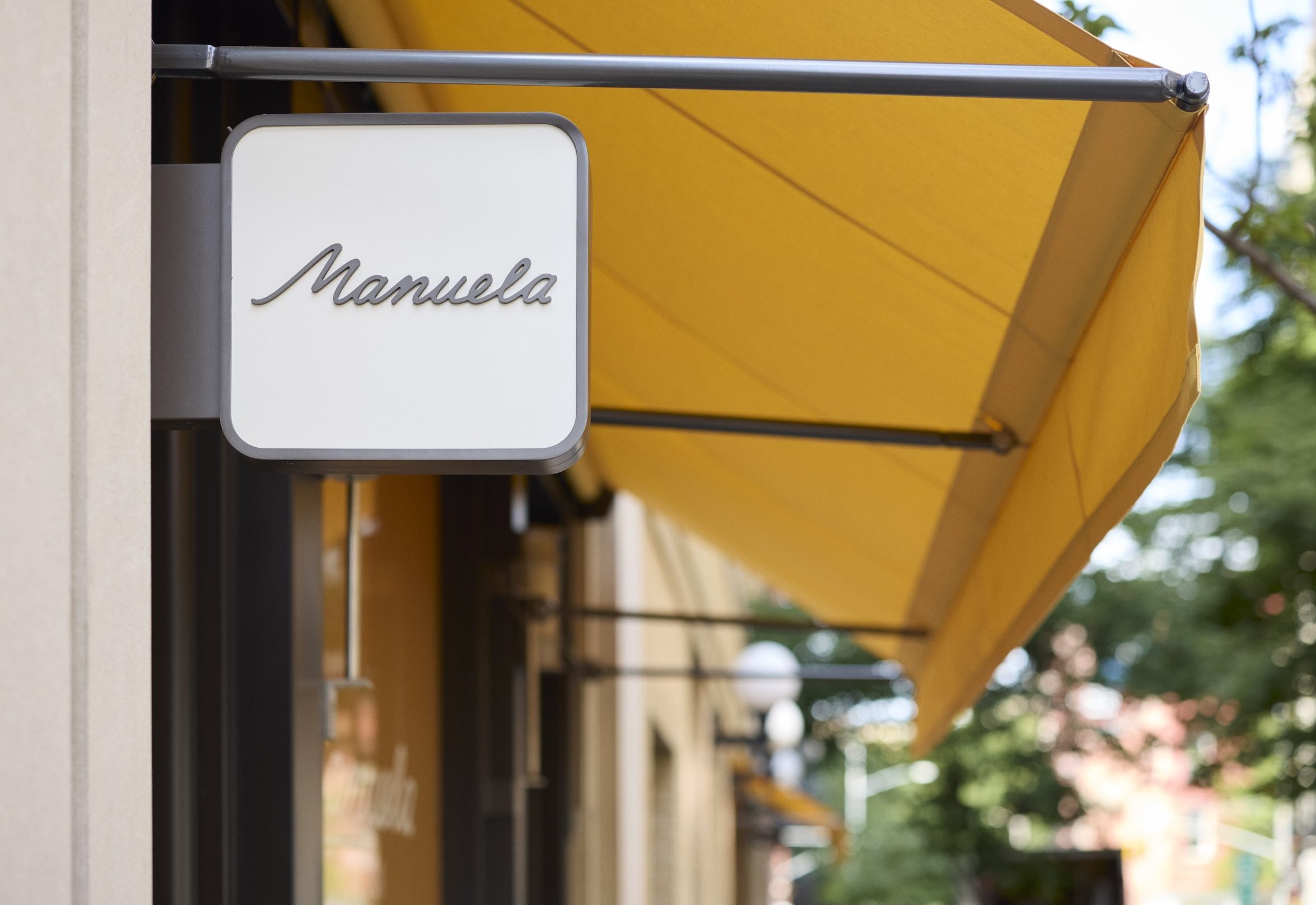 Manuela NY exterior sign