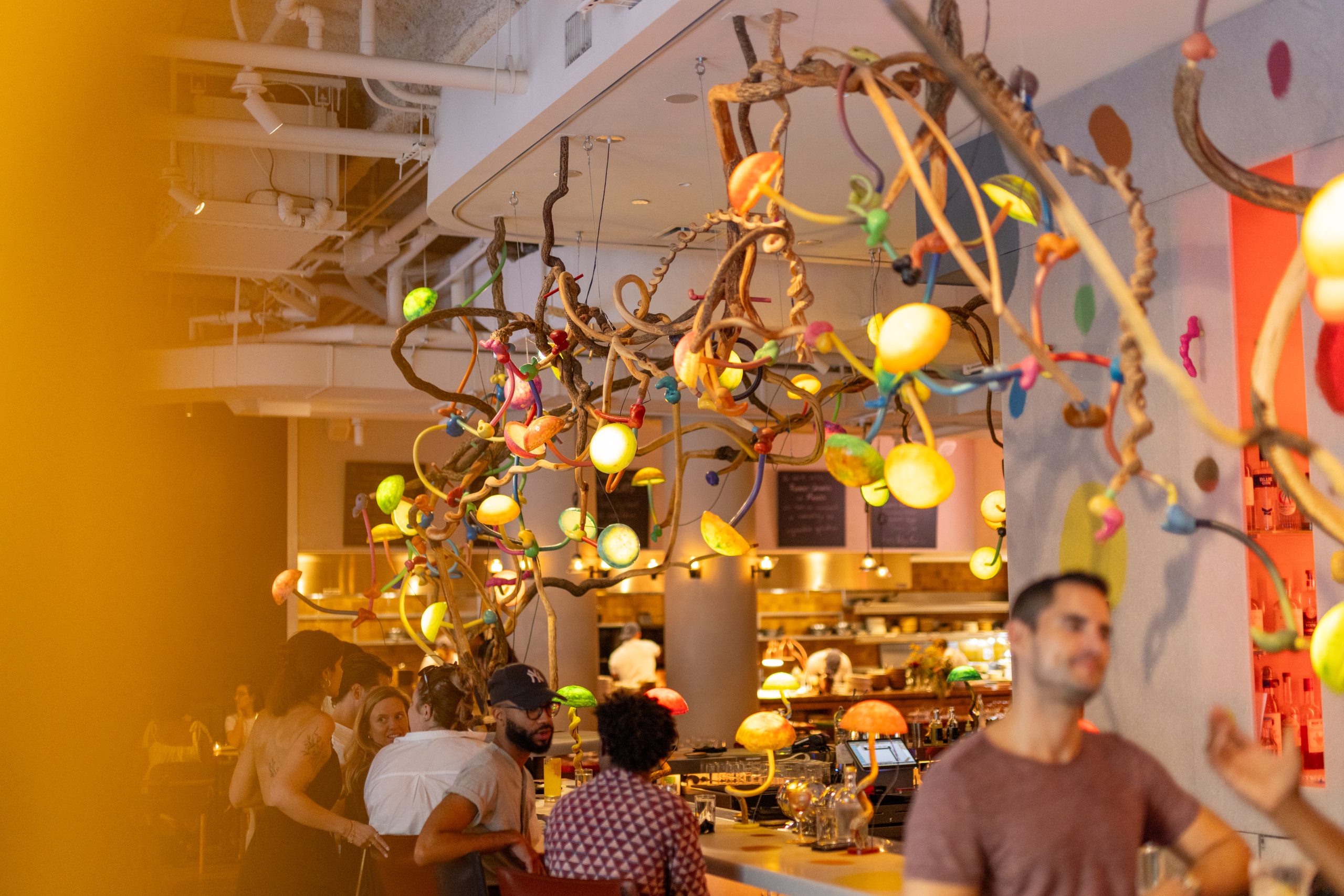 Manuela NYC interior, chandelier above the bar