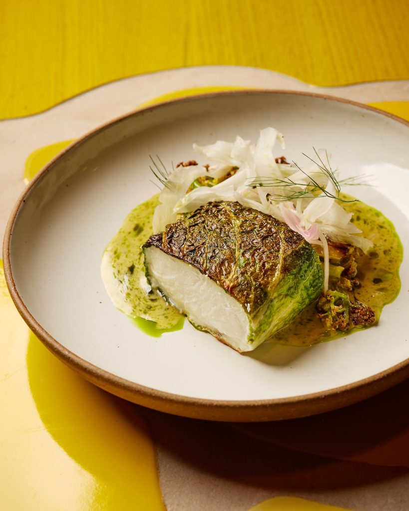Seared halibut with cabbage, fioretto cauliflower and sauce champagne