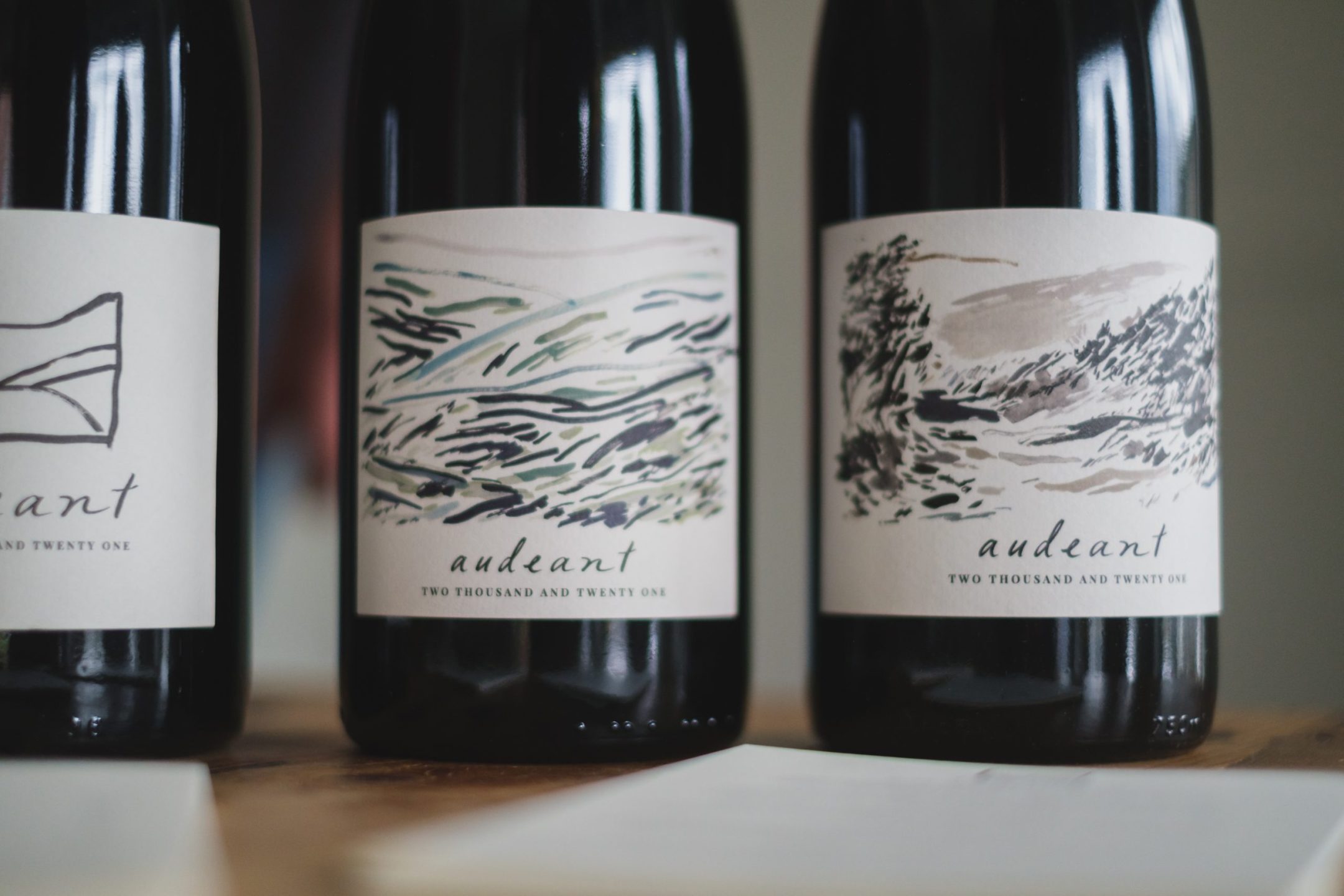 A close up of three wine bottles from Audeant Wines
