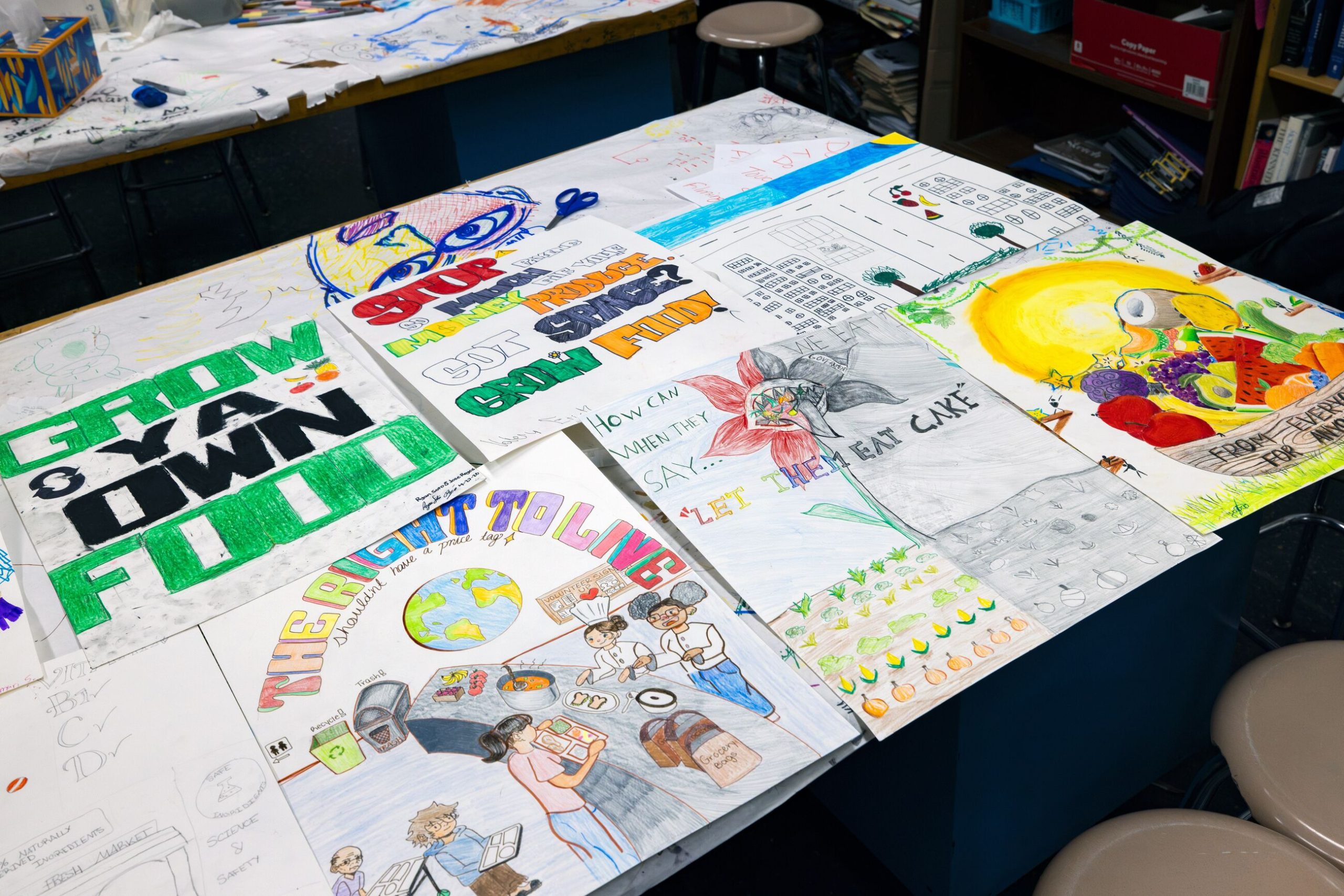 Allison Katz Poster Project – a selection of colourful illustrated posters on a table