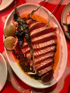 A cut tuna chop on a plate