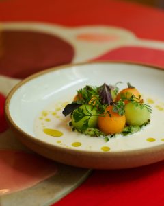 Tomato Tartare on a plate on a red table for Restaurant Week Menu