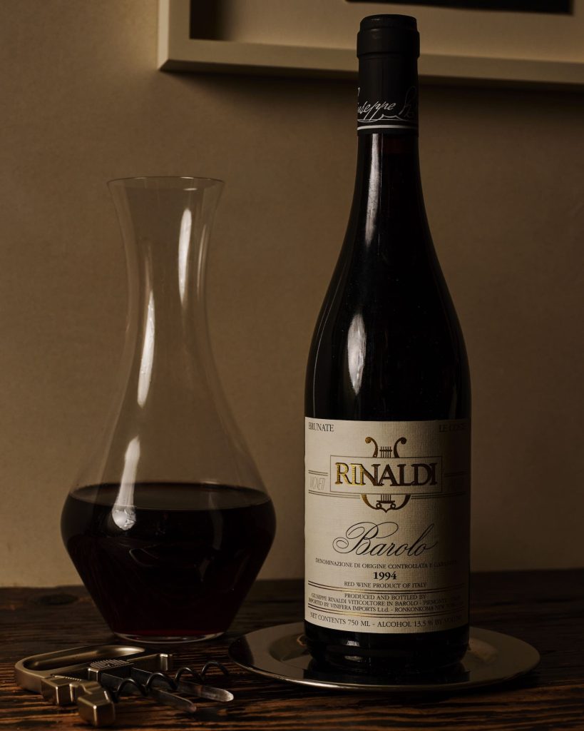 Bottle and carafe of red wine on a table